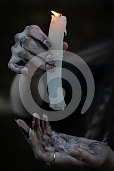 Hands and candle