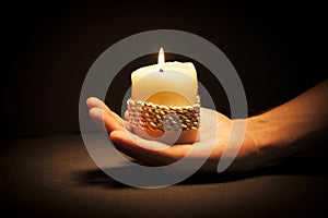 Hands with candle