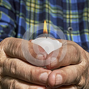 Hands and candle