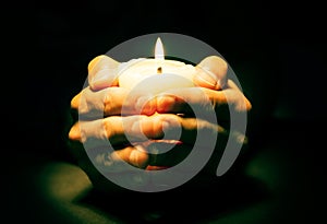 Hands with candle