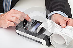 Hands with cash register photo