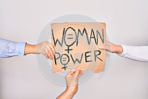 Hands of caucasian people asking for women rights holding banner with woman power message over isolated white background
