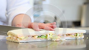 Hands chef prepare sandwiches