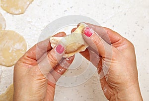 Hands of chef with ravioli