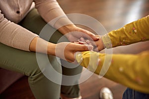 Hands of child in female hands, simple pleasures concept