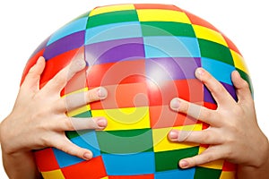 Hands of child hold big inflatable ball