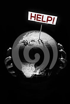 Hands of child holding globe. Our planet need help sign