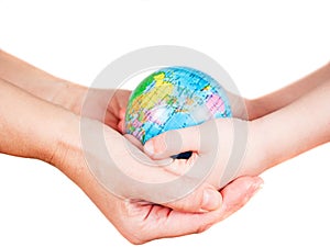Hands of a child and a woman holding globe