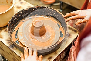 The hands of children learning pottery