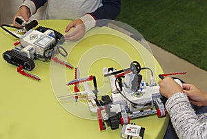 Hands of children in robotics classes