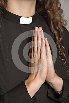 Hands clasped together saying prayers