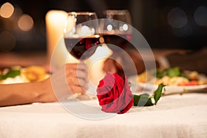 Hands Clinking Glasses On Served Restaurant Table. Shallow Depth