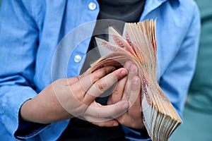 hands close-up consider a large currency of Russian rubles