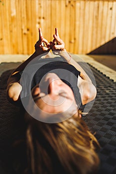 hands close up. Young athletic woman trainer practicing yoga instructor individual workout.balancing pose, modern gym, healthy