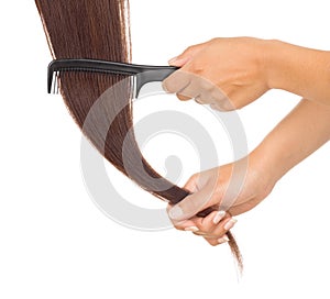 Hands combing her hair