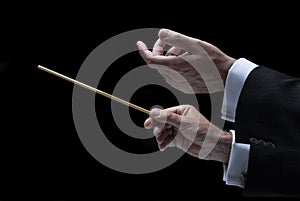 Hands of conductor with baton