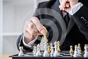 Hands of confident businessman playing chess game to development analysis new strategy plan, leader and teamwork concept for win