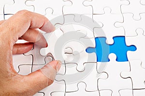 Hands connecting jigsaw