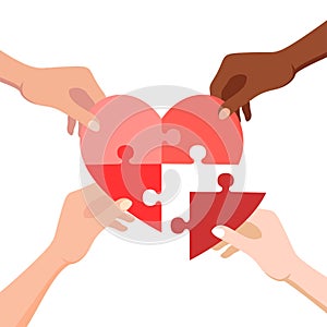 Hands connecting jigsaw puzzle in heart form. Concept of love, volunteering, charity and donation