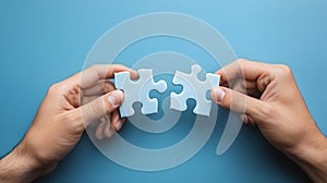 Hands Connecting Puzzle Pieces on Blue Background Symbolizing Problem Solving and Partnership