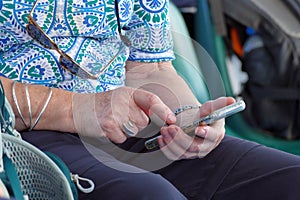 Hands continually touching the telephone keypad