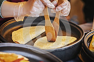 Hands of cook making healthy fresh fajitas, quesadilla, burrito on grill. Concept of national food, fast food