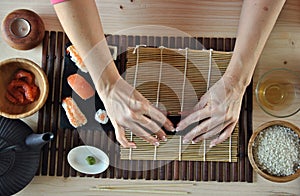 Hands cooking sushi
