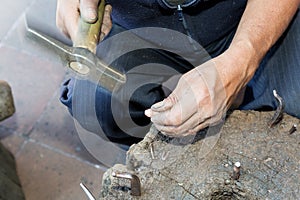 Hands of a coppersmith