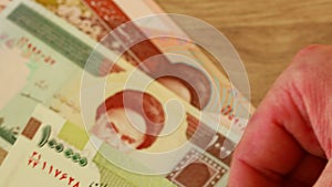 Hands Counting Iranian Paper Money, Rials, Various Denominations