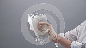 Hands counting protective medical masks, virus protection. shortage or deficiency of masks. COVID-19.