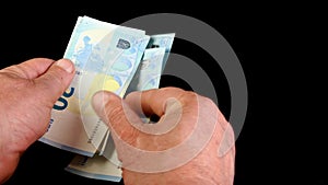 Hands counting stack cash twenty euro bills, recalculation banknotes.
