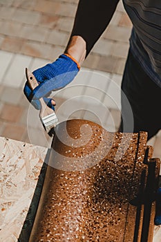 Put protective layer on tile with  brush