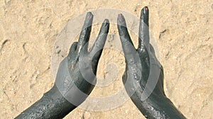 Hands covered with therapeutical mud