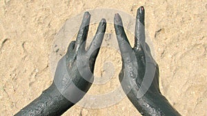Hands covered with therapeutical mud photo