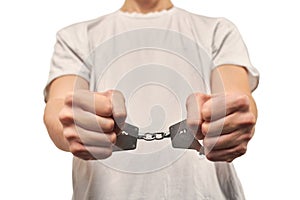 Hands of criminal in handcuffs, arrest of dangerous criminal, violation of law, white background