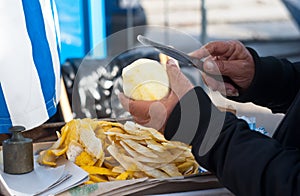Hands cutting a citron