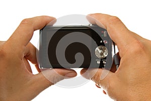 Hands with digital photo camera