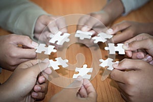 Hands of diverse people assembling jigsaw puzzle, Youth team put pieces together searching for right match, help support in