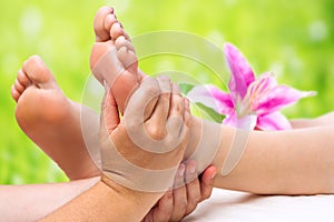 Hands doing foot massage
