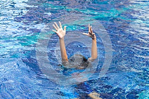 Hands of drown Kid in the deep water, need for help photo