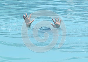 Hands of drowning boy