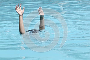 Hands of drowning boy