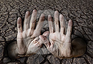 Hands and dry earth