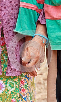 Hands of an elderly couple.