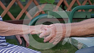 Hands Of Elderly Old People Saying Goodbye Close Up