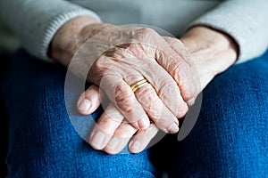 Hands of an elderly widow close up