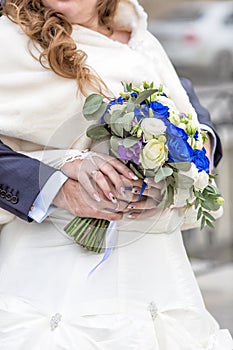 Hands with engagement rings of newly wedded