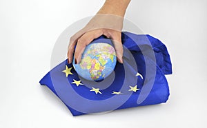 Hands with EU flag and globe september 11, 2016