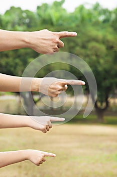 Hands of family pointing