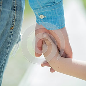 Hands. Father and son. Parents and children. Love and caring. Guardianship. Foster parents. Adopted children. Walk with photo